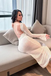 Detailed view of sexy backless white knit cover-up dress with long flared sleeves