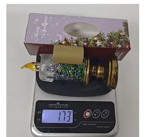 Kerst glitter kaarslamp gewichtsmeting van 173g met paarse verpakking in detail