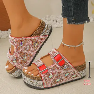 Detailed view of the 5.9cm platform height for these pearl and rhinestone red sandals.