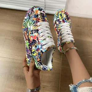 Vibrant graffiti-print sneakers with thick soles and white laces for fashionable women