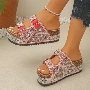 Close-up of wedge sandals featuring luxurious pearls, rhinestones, and cork platform soles.