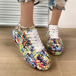 Fashionable vibrant graffiti print platform sneakers for women with white lace-up closure