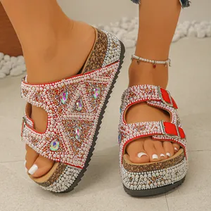 Detailed view of pearl and rhinestone embellished platform sandals with cork soles