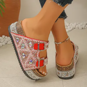 Detail of red platform slide sandals with pearl and teardrop rhinestone embellishments