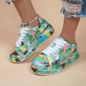 Close-up of vibrant graffiti print platform sneakers for women with white lace-up