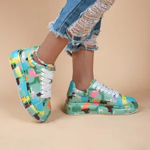 Close-up of colorful graffiti print platform sneakers for women with white laces