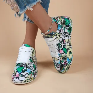 Vibrant graffiti sneakers for women with colorful cartoon prints and thick white laces