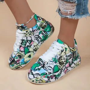 Detailed view of vibrant graffiti-style platform sneakers for women with white laces