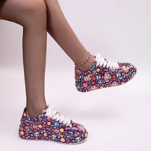 Detailed view of colorful graffiti printed platform sneakers with white laces.