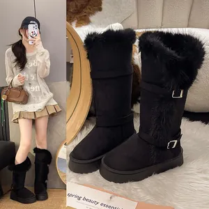 Detail view of tall black snow boots with faux fur trim alongside a model lifestyle shot