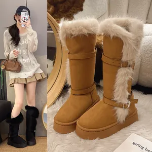 Detail view of tall winter snow boots with thick faux fur trim and platform sole.