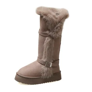 Women's tall snow boots featuring faux fur trim, buckle straps, and platform soles.