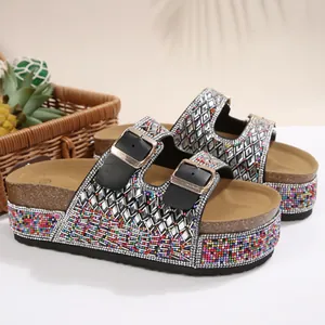 Detailed view of women's platform sandals with colorful beads and rhinestone straps