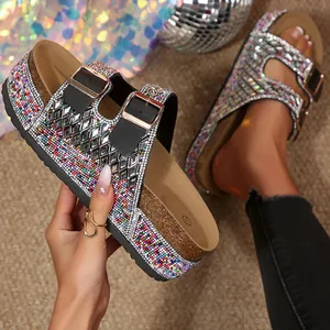 Close-up of sparkling rhinestone details on these stylish double buckle cork platform sandals