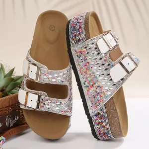 Detail view of women's platform sandals with shimmering rhinestones and colorful bead accents.