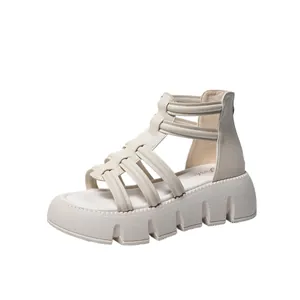 Zijaanzicht van gebroken witte gladiator platformsandalen met dikke profielzolen