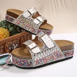 Detailed macro view of rhinestone platform sandals with colorful beads and double buckles