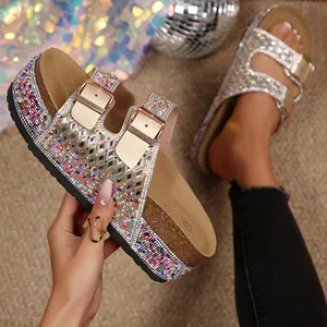 Close-up of glamorous double-buckle sandals adorned with vibrant multi-color rhinestones