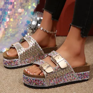 Close-up view of shimmering rhinestone double straps and colorful beaded platform soles