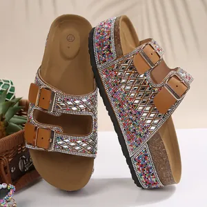 Close-up of rhinestone double buckle platform sandals with colorful bead detailing