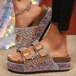 Macro view of glittering rhinestone and colorful beaded platform sandals with double buckles