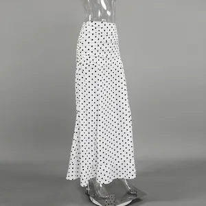 Elegant French style high-waisted white polka dot maxi skirt with ruched fishtail hem