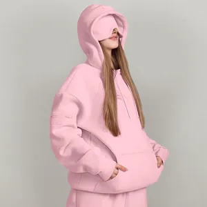 Close-up of pink oversized hoodie featuring a unique built-in eye mask for comfort.