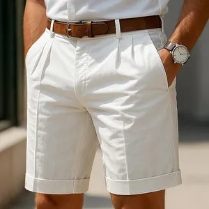 Close-up of premium men's off-white business casual shorts with pleated front and cuffed hem