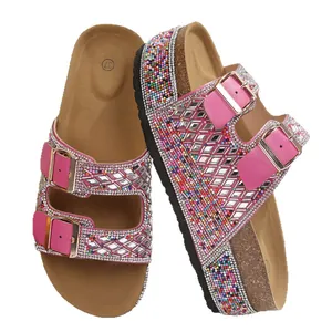 Pink platform slides with rhinestone double buckles and colorful bead accents.