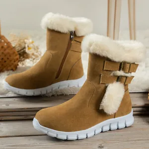 Detail view of warm camel snow boots with white faux fur trim and side buckles