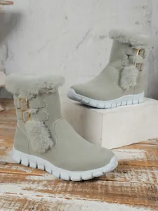 Detailed view of women's warm grey snow boots with faux fur trim and platform soles.