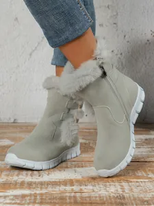 Side view of grey women's plush snow boots featuring white non-slip thick soles