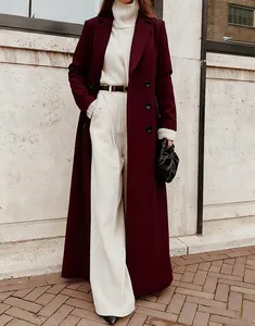 Stylish long burgundy wool coat for women shown in an elegant outdoor winter street setting