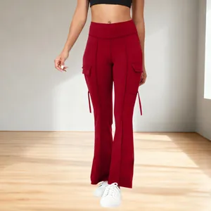 Full view of red high-waisted flared yoga pants with stylish side pocket details