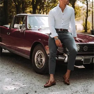 Business casual white long sleeve shirt for men styled with vintage car background