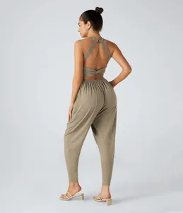 Rear view of women's backless halter crop top and jogger pants set in olive khaki