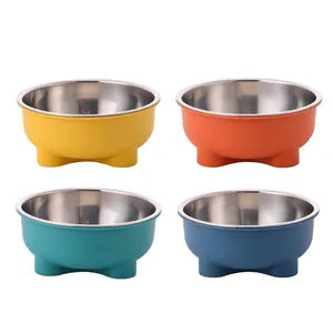 Set of four colorful stainless steel pet bowls for cats and dogs in white background