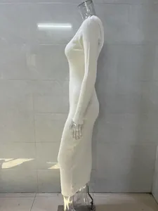 Side profile of an elegant white long-sleeved ribbed knit bodycon maxi dress for women