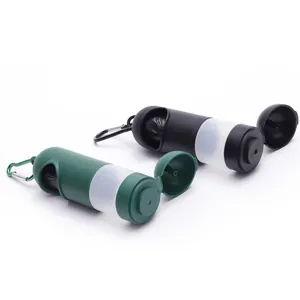 Close-up of portable pet waste bag dispenser with carabiner in green and black colors