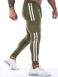 Side view detail of olive green men's joggers with white stripes and cargo pocket
