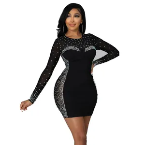 Detailed shot showing the black long-sleeve bodycon dress with rhinestone mesh accents