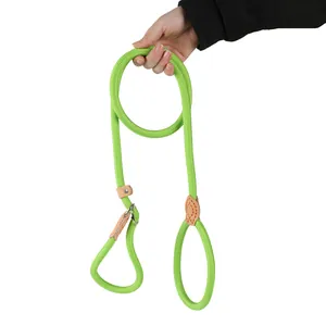 Detailed close-up of a durable green braided P-leash being held for dog training