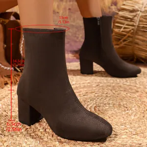 Detailed brown suede chunky heel ankle boots showing shaft height and heel measurements