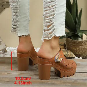 Brown platform high-heeled mules featuring hollow-out floral patterns and a metal buckle detail.