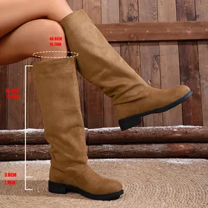 Detail view of brown slouched western boots with shaft height and circumference measurements