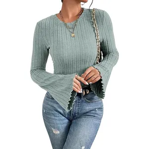 Close-up of ribbed long sleeve top with stylish flared bell cuffs in sage green