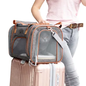 Gray breathable pet carrier bag featuring mesh windows and brown leather trim detail
