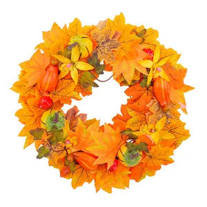 Autumn harvest door wreath with maple leaves and pumpkins for Halloween decoration