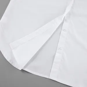 Detailed macro shot of white cotton shirt curved hem and front button placket for women
