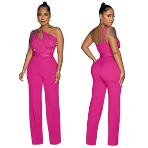 Elegant magenta one-shoulder wide-leg jumpsuit with gold stud details and a matching belt